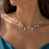 model wearing oval brilliant lab grown diamond dancing necklace.png